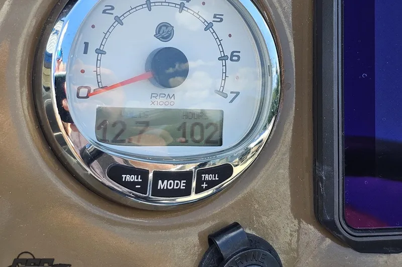 Slide: The Image of Tachometer display on 2021 Regency 230 LE3 boat showing RPM and voltage. - 84