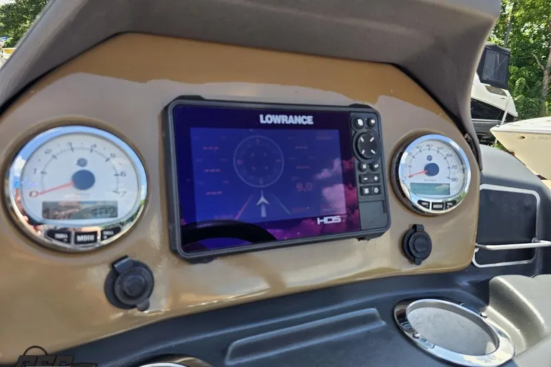 Slide: The Image of Dashboard of 2021 Regency 230 LE3 boat with Lowrance display and gauges. - 85
