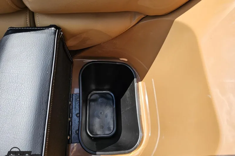 Slide: The Image of Cup holder in 2021 Regency 230 LE3 boat with tan leather seating. - 96