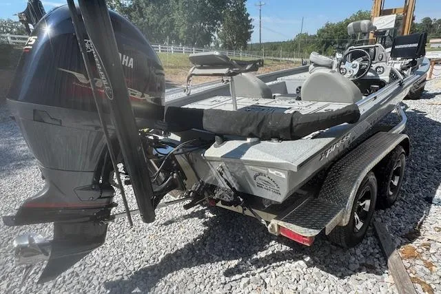 Slide: The Image of 2022 Xpress X19 Pro boat with Yamaha engine on gravel surface. - 10