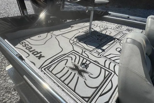 Slide: The Image of 2022 Xpress X19 Pro boat interior with custom deck design and seating. - 13