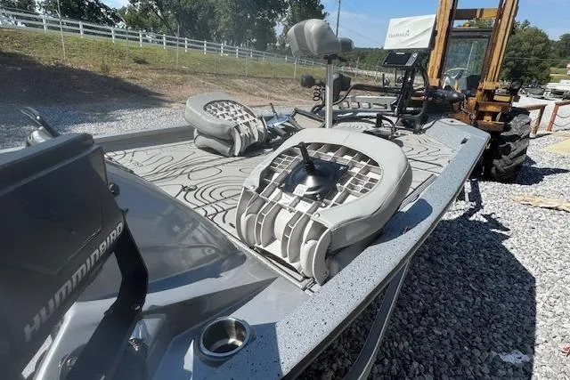 Slide: The Image of 2022 Xpress X19 Pro boat with Humminbird electronics on gravel surface. - 14