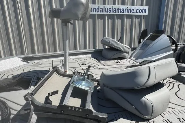 Slide: The Image of 2022 Xpress X19 Pro boat interior with gray seating and steering console. - 4