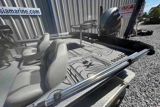 Slide: The Image of 2022 Xpress X19 Pro boat with Yamaha engine, gray seats, and custom deck design. - 7