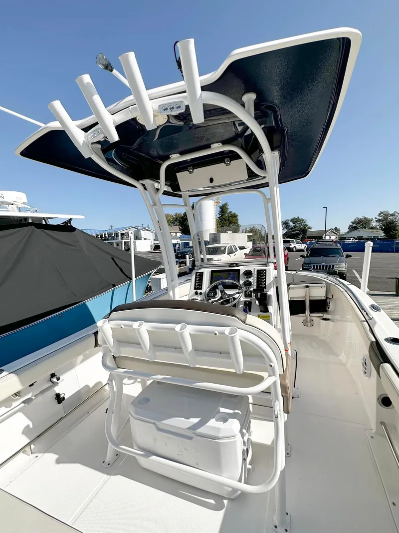 Slide: The Image of 2021 Robalo R222 Explorer boat interior with T-top and seating. - 13