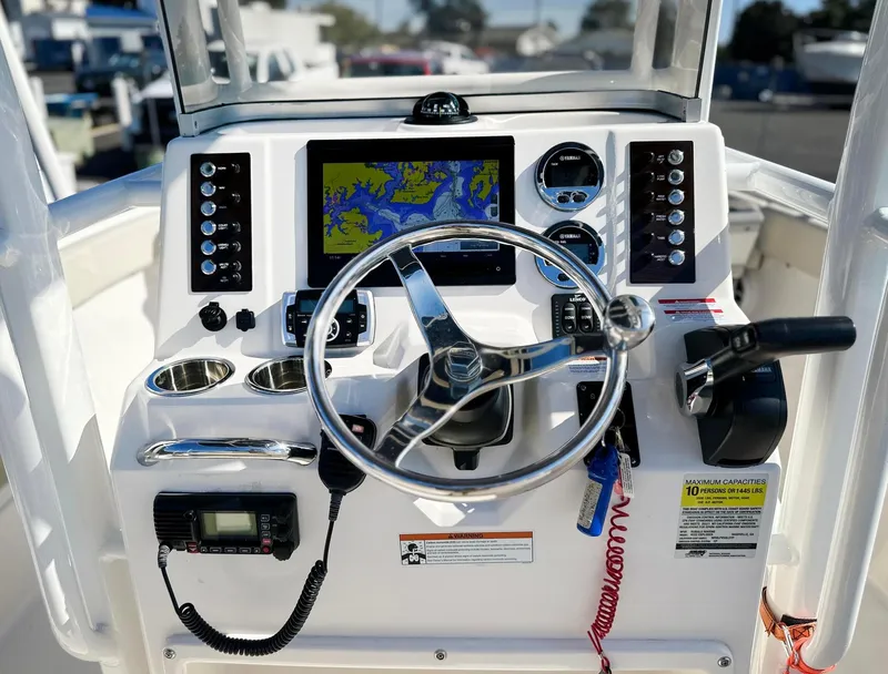 Slide: The Image of 2021 Robalo R222 Explorer boat dashboard with navigation system and controls. - 14