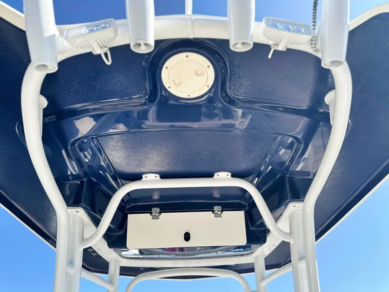 Slide: The Image of 2021 Robalo R222 Explorer boat's T-top underside with rod holders, viewed from below. - 22