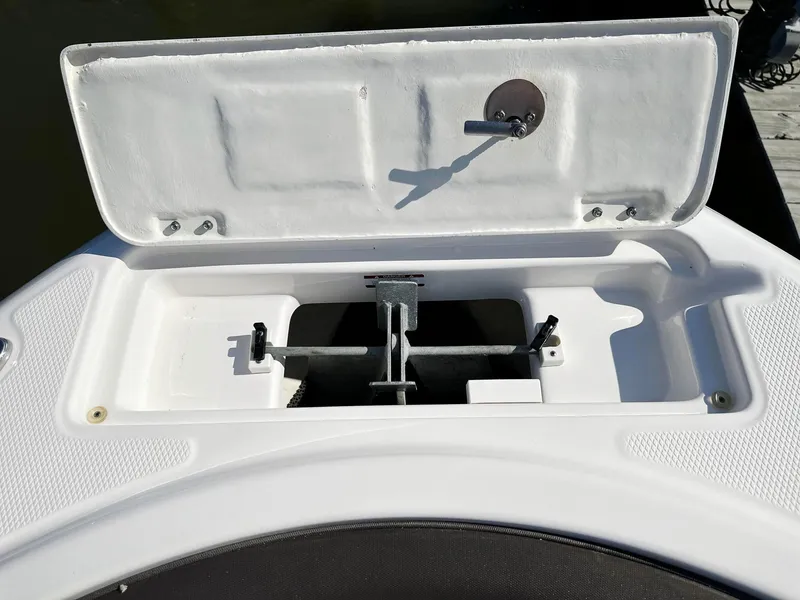 Slide: The Image of 2021 Robalo R222 Explorer anchor storage compartment open on deck. - 5