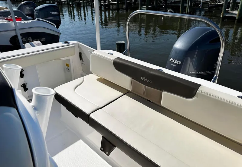 Slide: The Image of 2021 Robalo R222 Explorer boat interior with seating and Yamaha outboard motor. - 9