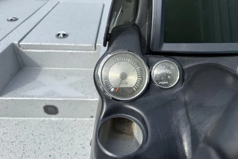 Slide: The Image of Dashboard of 2016 Xpress XCLUSIVE SERIES X21 boat with RPM and fuel gauges. - 13