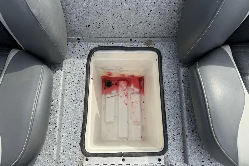 Slide: The Image of 2016 Xpress XCLUSIVE SERIES X21 boat interior with storage compartment. - 16