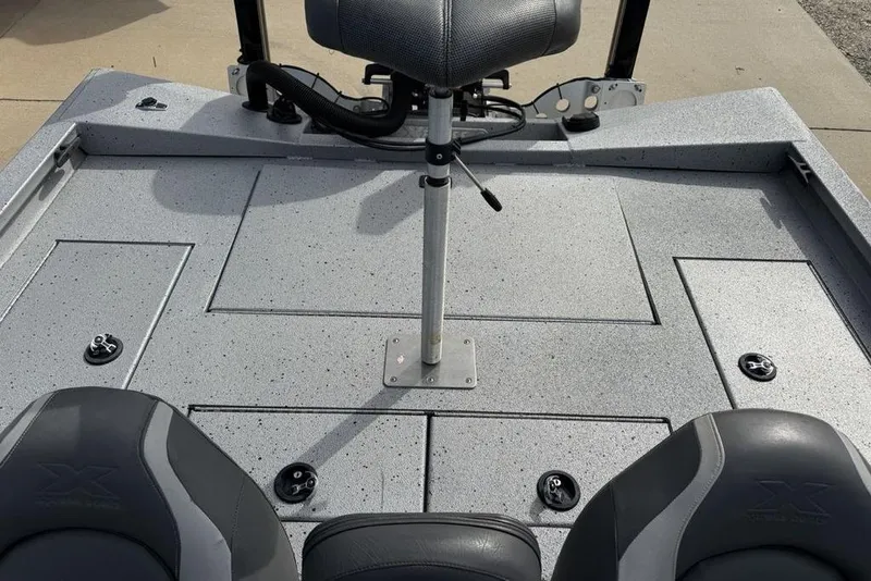 Slide: The Image of 2016 Xpress XCLUSIVE SERIES X21 boat interior with seating and storage compartments. - 17