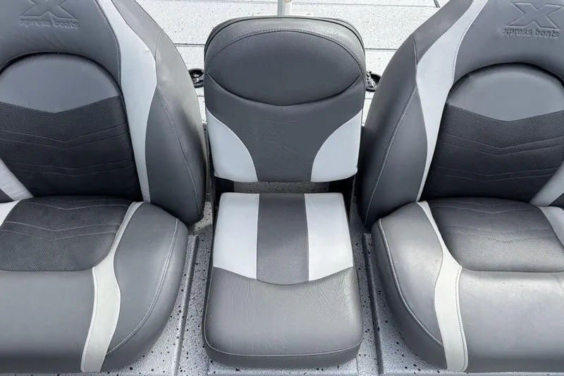 Slide: The Image of Gray and white seats of 2016 Xpress XCLUSIVE SERIES X21 boat interior. - 19