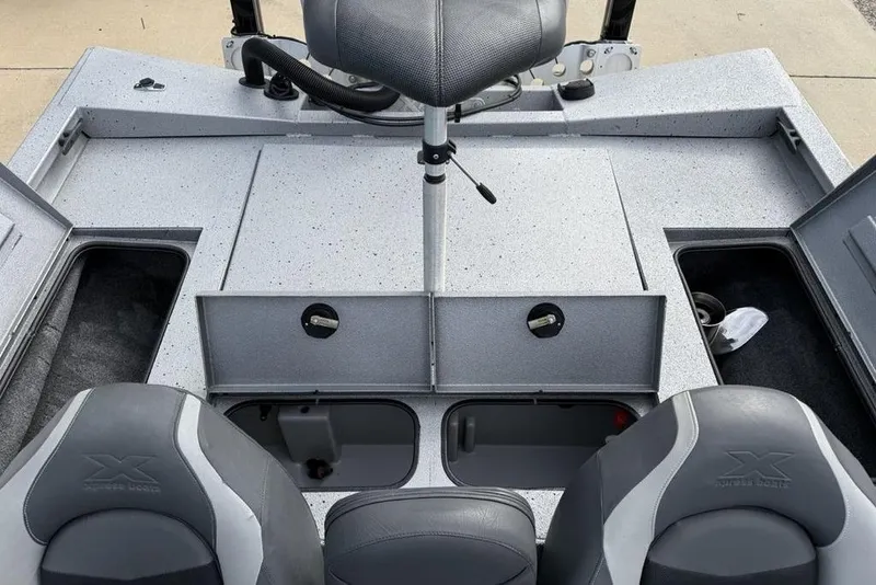 Slide: The Image of 2016 Xpress XCLUSIVE SERIES X21 boat interior with storage compartments and seating. - 22