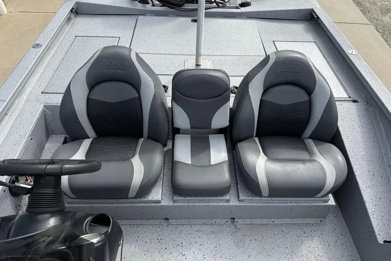 Slide: The Image of 2016 Xpress XCLUSIVE SERIES X21 boat interior with three gray seats. - 6