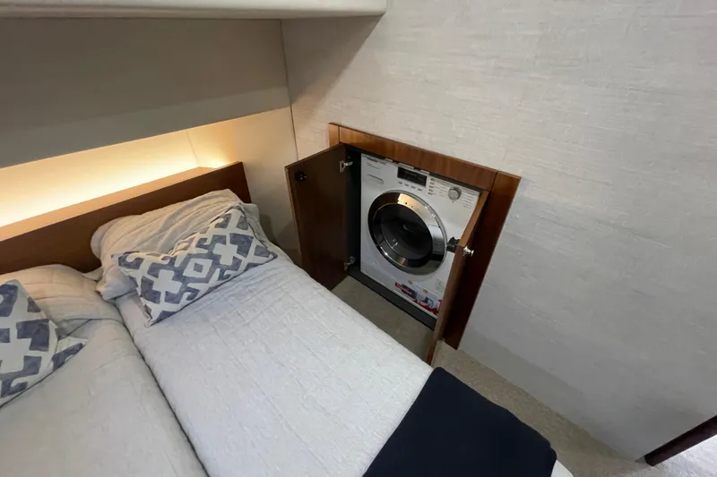 Slide: The Image of Luxurious bedroom interior of 2020 Maritimo 59 Motoryacht with modern decor and cozy seating. - 39