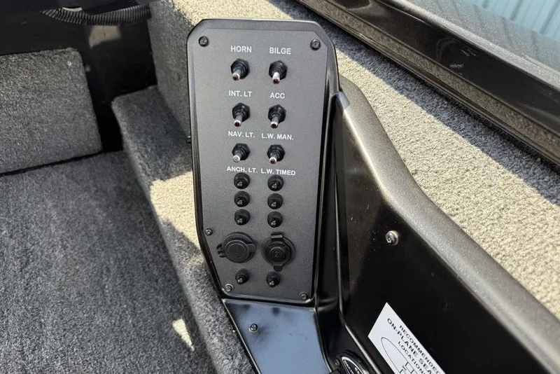 Slide: The Image of Control panel of 2023 Vexus AVX189 boat with switches for horn, bilge, and lights. - 14