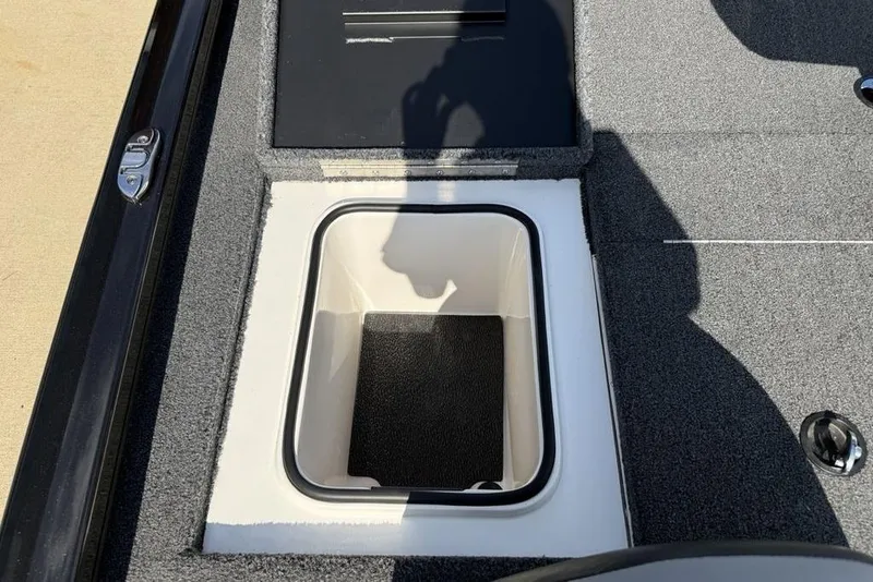 Slide: The Image of 2023 Vexus AVX189 boat storage compartment with open lid, showcasing interior design. - 23