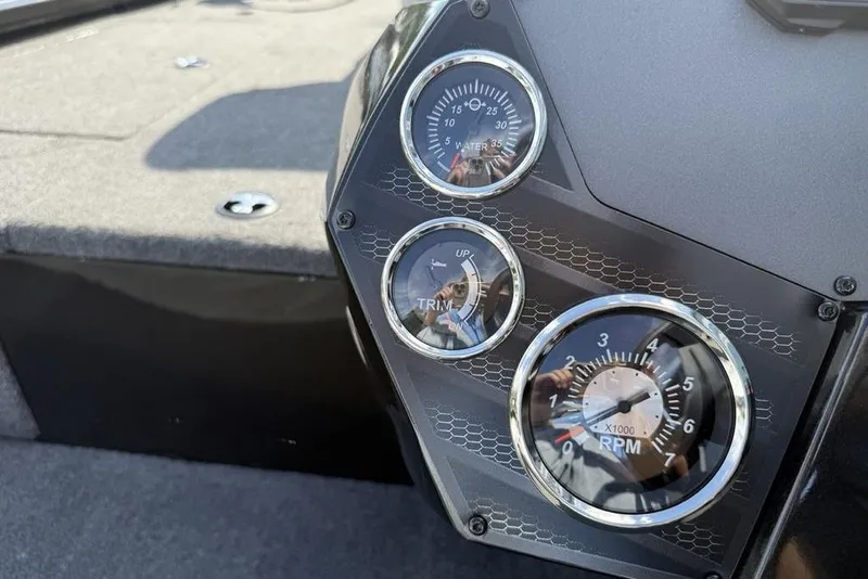 Slide: The Image of Dashboard of 2023 Vexus AVX189 boat with gauges for water pressure, trim, and RPM. - 6