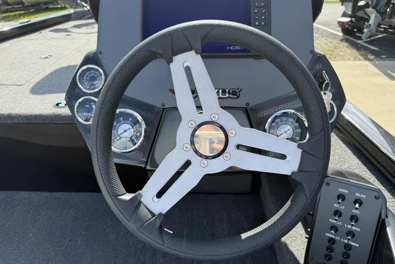 Slide: The Image of 2023 Vexus AVX189 boat dashboard with steering wheel and instrument panel. - 8