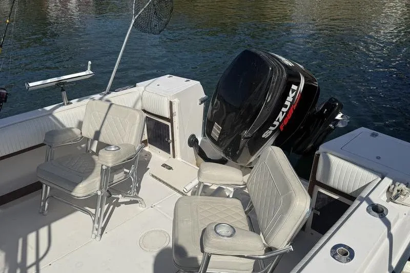 Slide: The Image of 1995 Grady-White Gulfstream 232 boat interior with Suzuki outboard motor. - 5