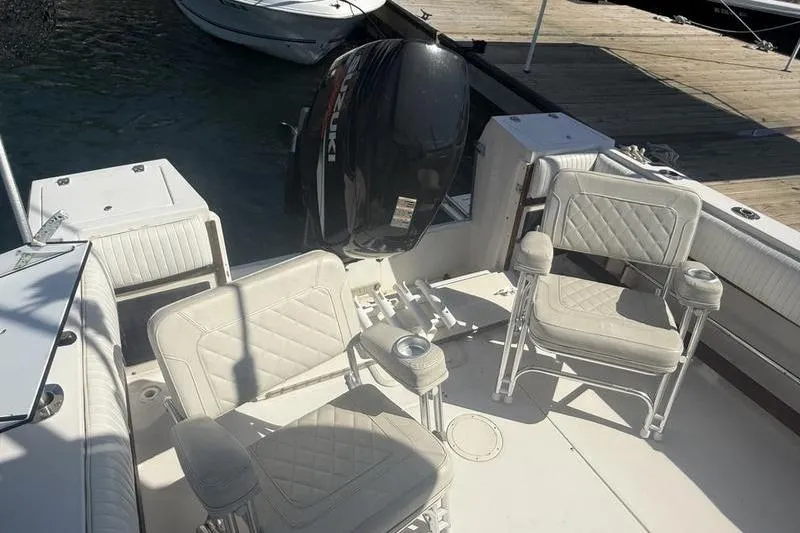 Slide: The Image of 1995 Grady-White Gulfstream 232 boat interior with seating and outboard motor. - 9