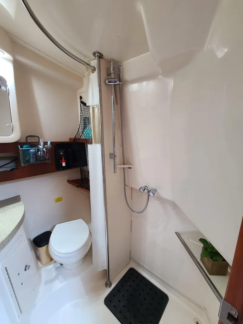 Slide: The Image of 2011 Grady-White Express 360 boat bathroom with shower and toilet. - 22