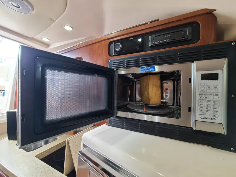 Slide: The Image of Microwave in 2011 Grady-White Express 360 boat kitchen interior. - 25