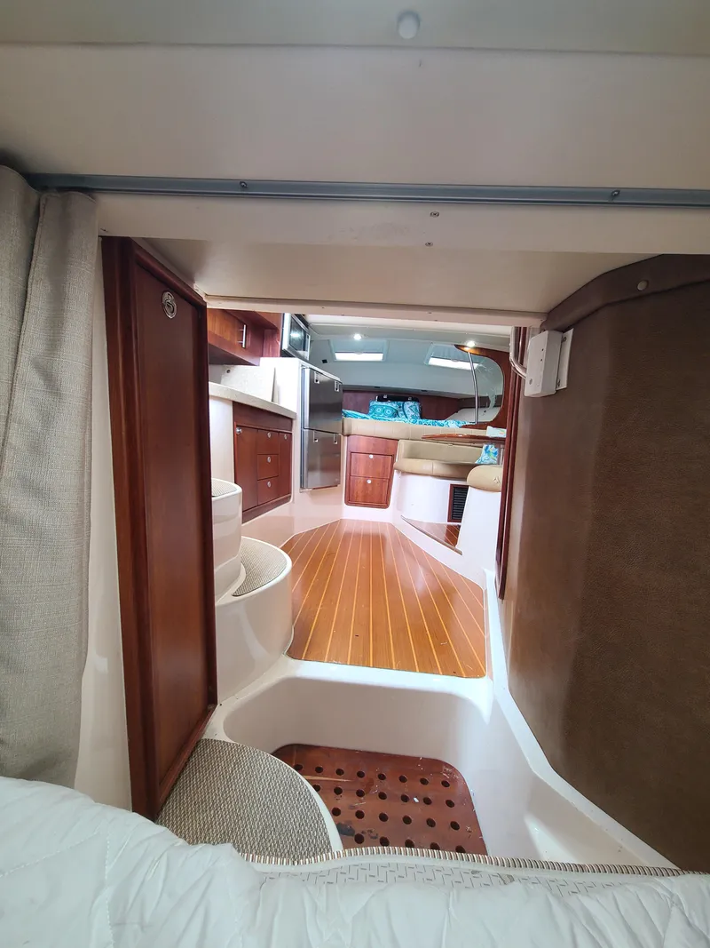 Slide: The Image of 2011 Grady-White Express 360 interior with wood flooring and modern amenities. - 27