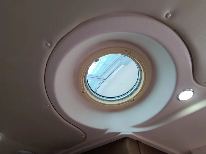 Slide: The Image of Porthole view inside 2011 Grady-White Express 360 boat cabin ceiling. - 31