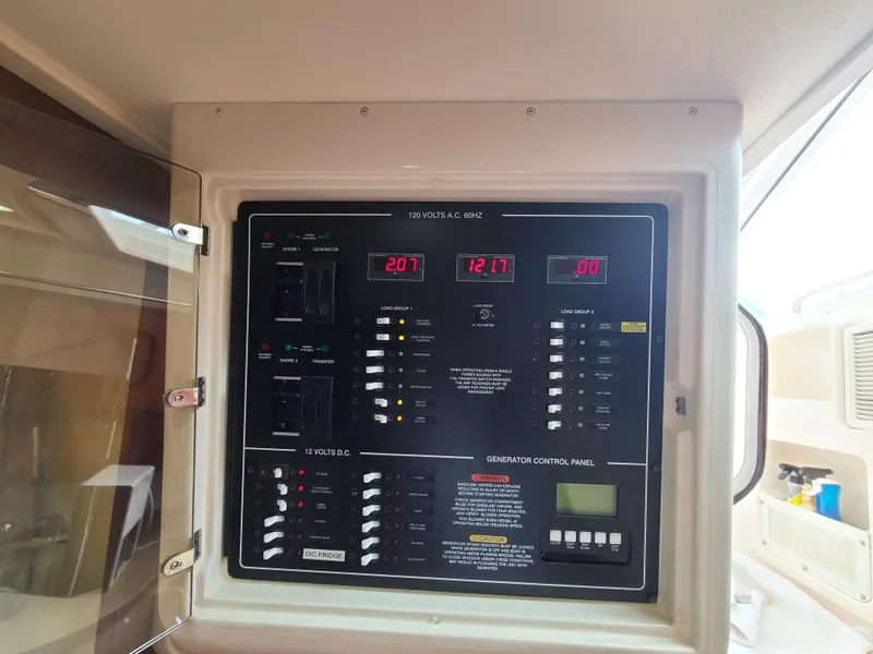 Slide: The Image of Electrical control panel on 2011 Grady-White Express 360 boat. - 33