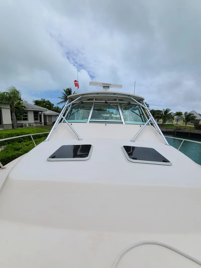 Slide: The Image of 2011 Grady-White Express 360 boat docked under cloudy skies. - 35