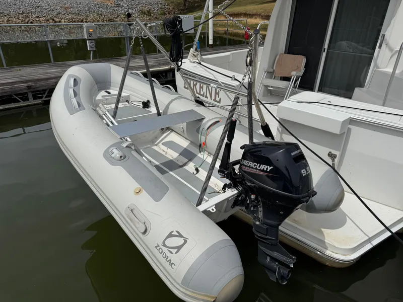Slide: The Image of Inflatable Zodiac boat with Mercury 9.9 motor on 2001 Mainship 390 yacht. - 27