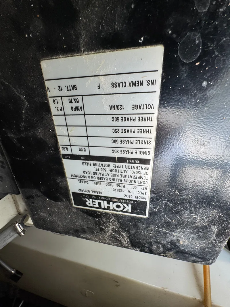 Slide: The Image of Kohler generator label on a 2001 Mainship 390 boat, displaying electrical specifications. - 47