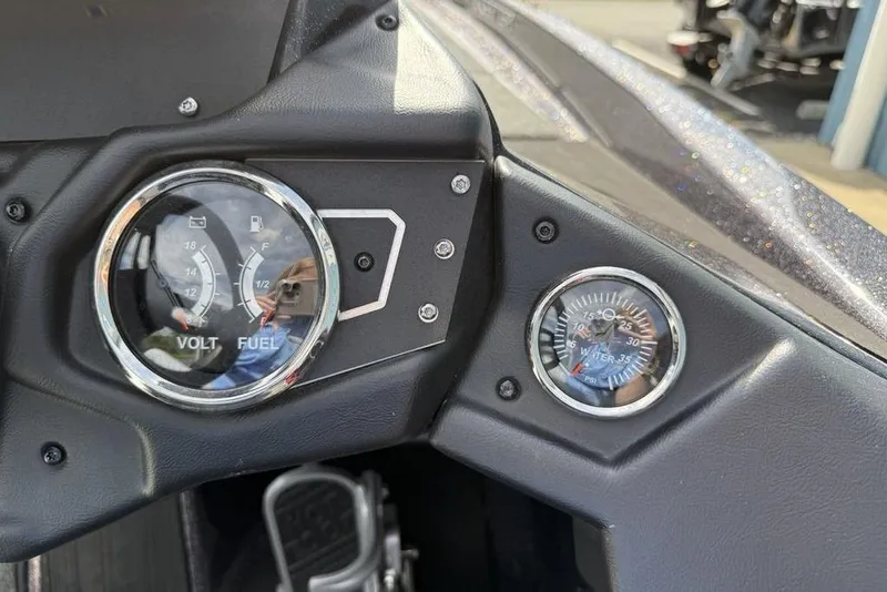 Slide: The Image of 2023 Ranger RT198P dashboard with volt, fuel, and water pressure gauges. - 12