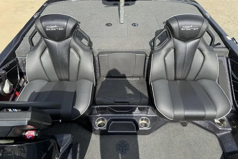 Slide: The Image of 2023 Ranger RT198P boat interior with dual black seats and center console. - 13