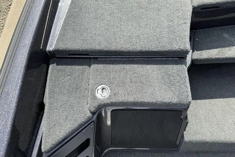 Slide: The Image of 2023 Ranger RT198P boat deck with gray carpet and storage compartment. - 14