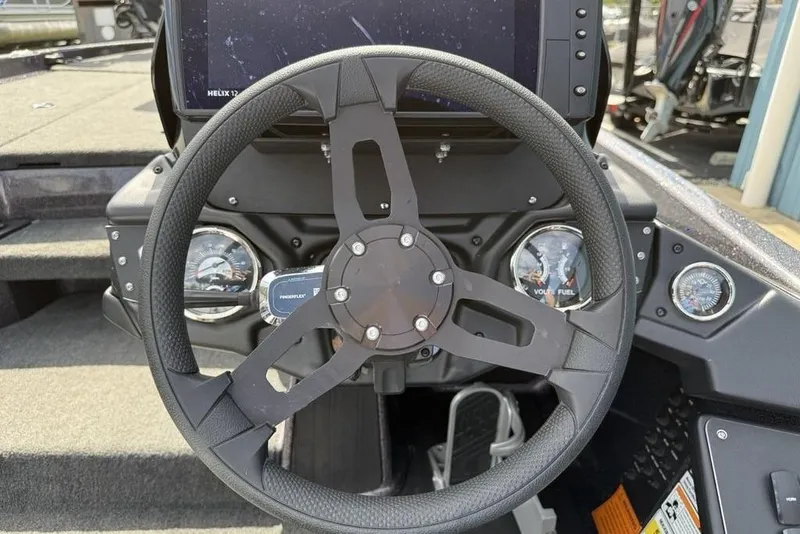 Slide: The Image of 2023 Ranger RT198P boat dashboard with steering wheel and gauges. - 16