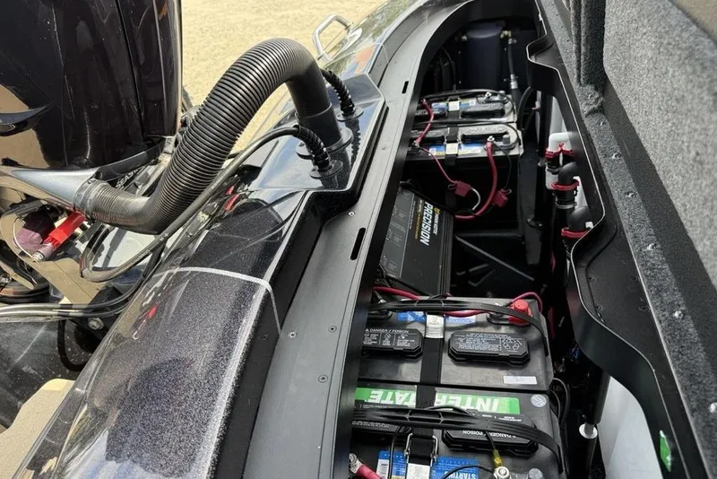 Slide: The Image of 2023 Ranger RT198P boat battery compartment with multiple batteries and wiring. - 25