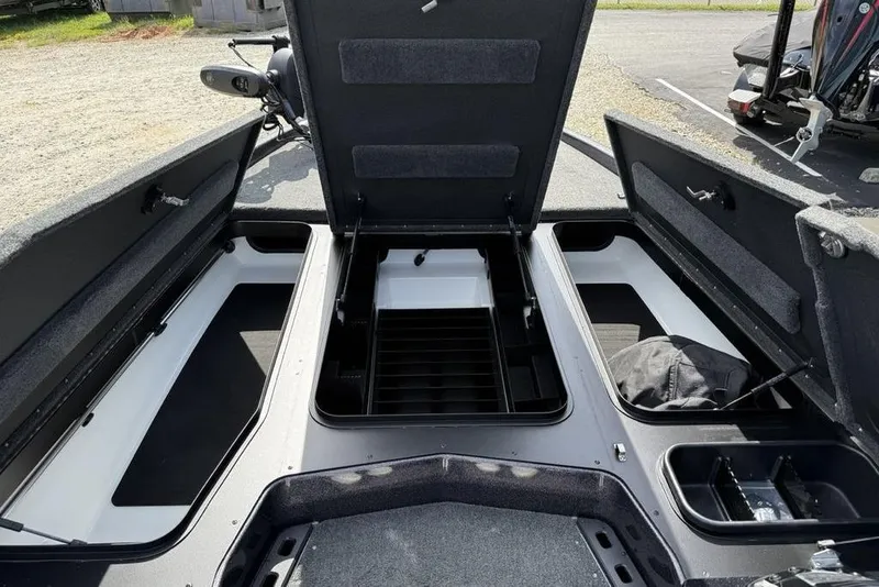 Slide: The Image of 2023 Ranger RT198P boat storage compartments open, showcasing spacious interior design. - 9