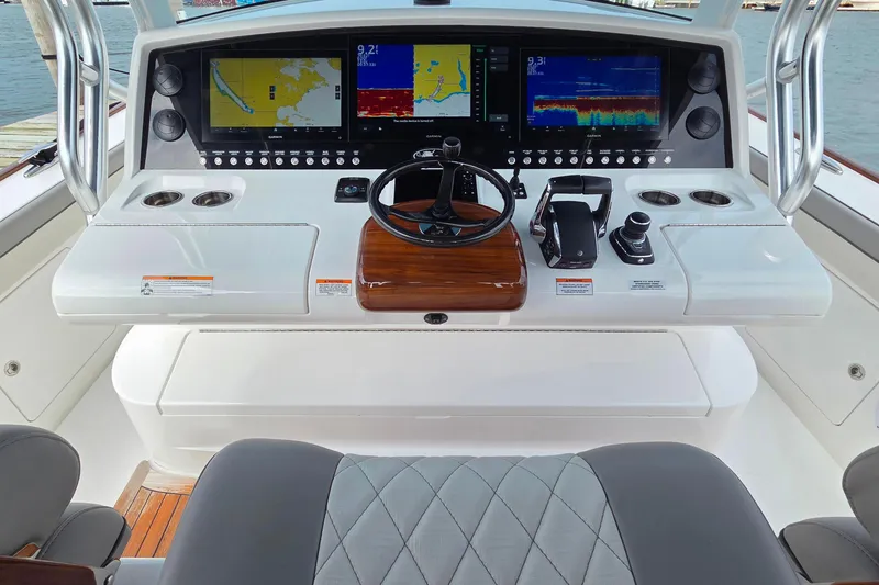 Slide: The Image of 2025 Valhalla Boatworks V-46 helm with advanced navigation displays and controls. - 11