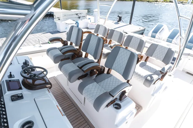 Slide: The Image of 2025 Valhalla Boatworks V-46 interior with luxurious seating and modern helm controls. - 13