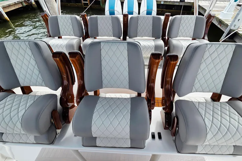 Slide: The Image of Luxurious seating on 2025 Valhalla Boatworks V-46, featuring elegant quilted upholstery. - 14