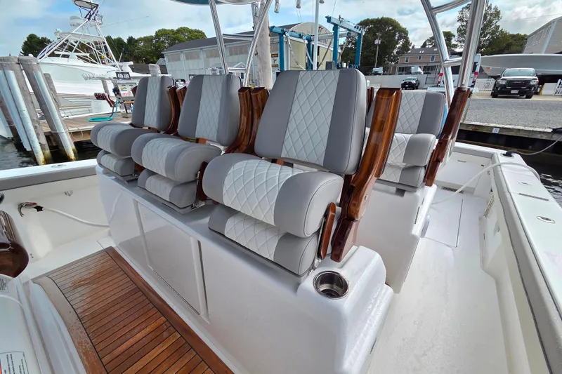 Slide: The Image of 2025 Valhalla Boatworks V-46 interior with luxurious seating and elegant wood accents. - 15