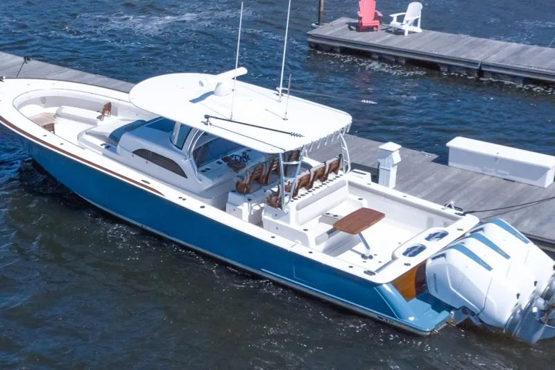 Slide: The Image of 2025 Valhalla Boatworks V-46 in water, featuring sleek design and powerful engines. - 2