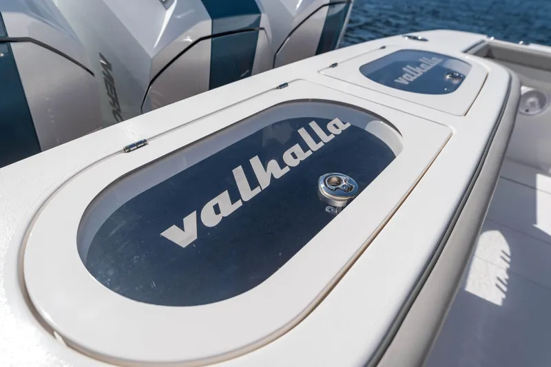 Slide: The Image of 2025 Valhalla Boatworks V-46 deck with branded storage compartments. - 20