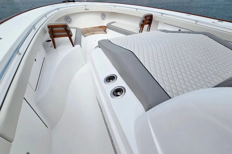 Slide: The Image of 2025 Valhalla Boatworks V-46 interior with cushioned seating and sleek design. - 23