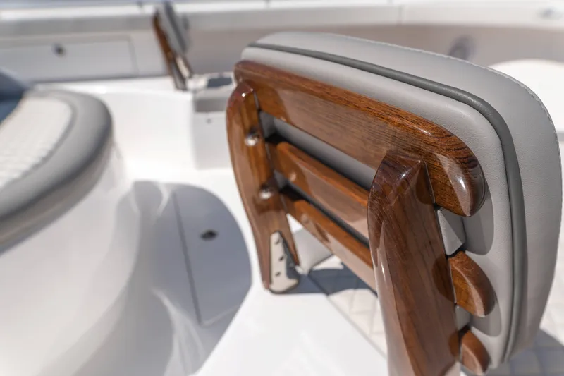 Slide: The Image of 2025 Valhalla Boatworks V-46 interior with elegant wood and leather seating detail. - 26