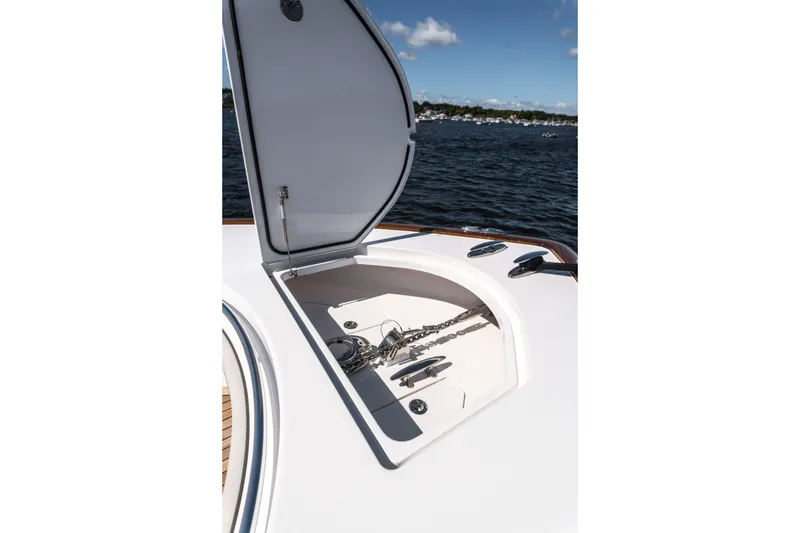 Slide: The Image of 2025 Valhalla Boatworks V-46 anchor compartment open on deck, ocean background. - 27