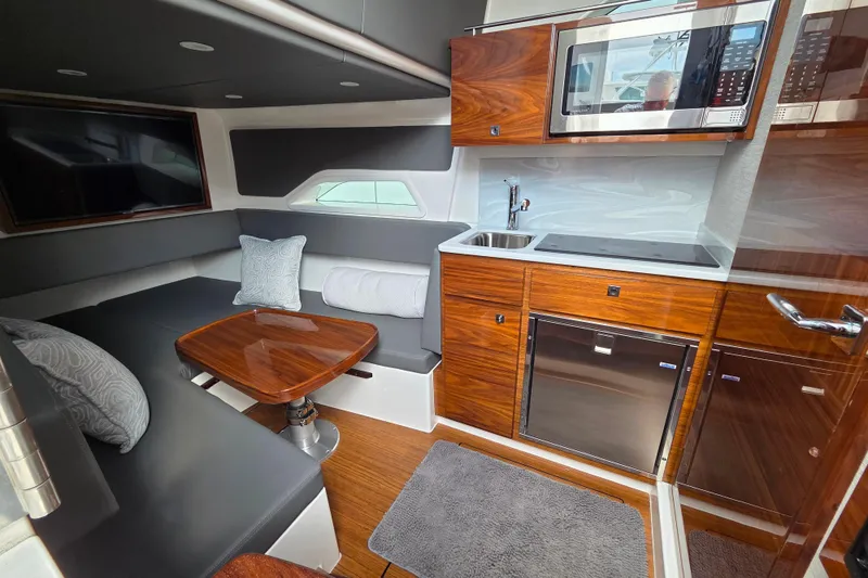 Slide: The Image of Luxurious interior of 2025 Valhalla Boatworks V-46 with modern kitchen and seating area. - 28